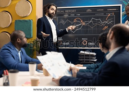 Chief operating officer presenting project goals and resource allocation during a meeting, creating successful pitch to present his ideas. Review performance indicators and marketing strategies.