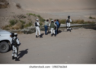 Juárez, Chihuahua, Mexico, 05-10-2021 National Guard Detains A Family Of Migrants From Haiti, The Family Tried To Cross The Rio Grande Illegally To Reach The United States To Request Political Asylum.