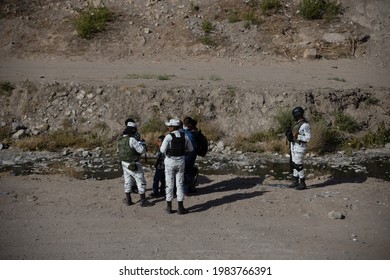 Juárez, Chihuahua, Mexico, 05-10-2021 National Guard Detains A Family Of Migrants From Haiti, The Family Tried To Cross The Rio Grande Illegally To Reach The United States To Request Political Asylum.