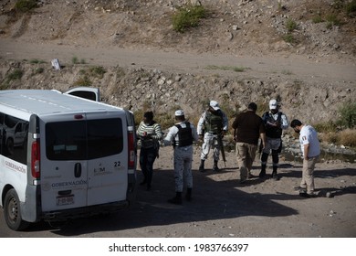 Juárez, Chihuahua, Mexico, 05-10-2021 National Guard Detains A Family Of Migrants From Haiti, The Family Tried To Cross The Rio Grande Illegally To Reach The United States To Request Political Asylum.