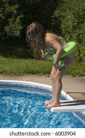 Child About To Jump From Diving Board