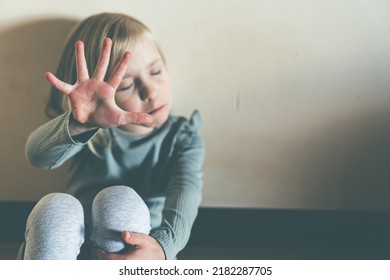 Child Abuse, Violence Concept - Young Girl With Her Hand Out As A Stop Sign. Human Rights Campaign