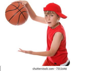 A Child In Action Playing A Game Of Basketball