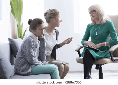 Child And Adolescent Mental Health Concept, Mother Of Female Teenager With Anxiety During Psychological Consultation With Professional Therapist