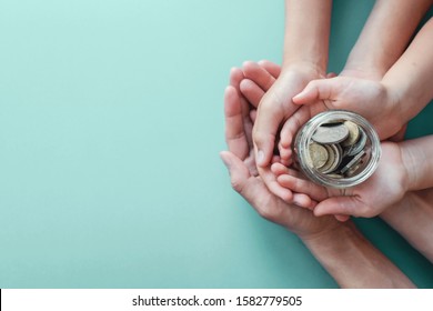 Child And Adult Holding Money Jar, Donation, Saving, Fundraising Charity, Family Finance Plan, Inflation, Superannuation Concept