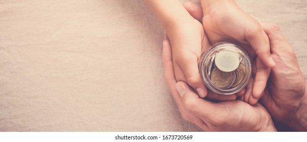 child and adult holding money jar, donation, saving, charity, family finance plan concept, Coronavirus economic stimulus rescue package, superannuation concept