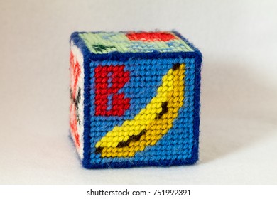 Child Alphabet Block For Letter B Made From Needlepoint. Letter With Image Of Banana. White Background.