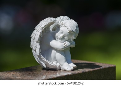 Child Angel Statue On Gravestone