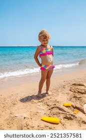 Child applying sunscreen. Selective focus Kid