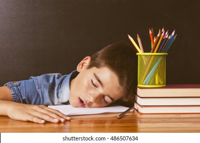 Child Asleep On The Table School