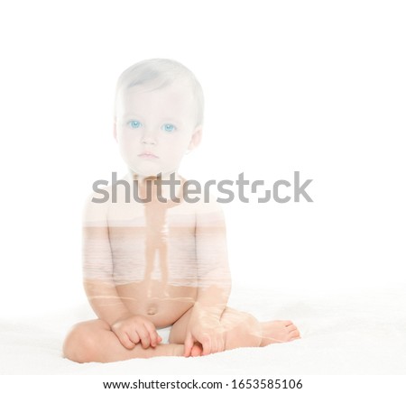 Nude baby posing in her mother’s arms