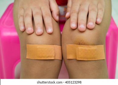 Child With Band Aid On Knee Close Up