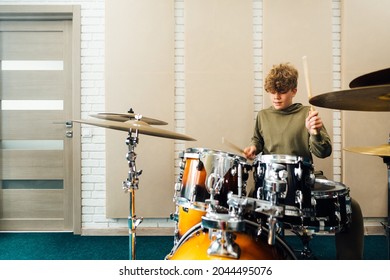 The Child Behind The Drum Kit. Lesson At The Music School.
