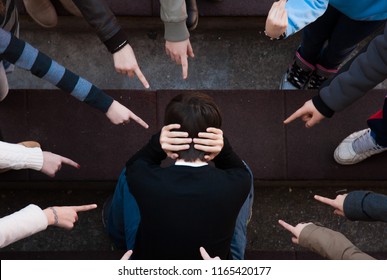 A Child Being Bullied By A Group Of Children. Bullying Scene 