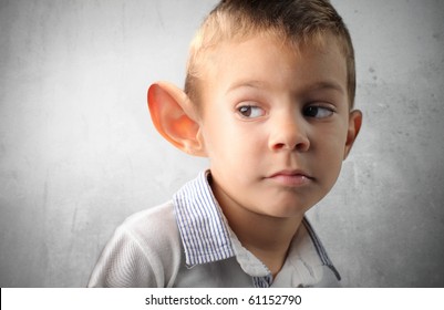 Child With Big Ear Listening To Something