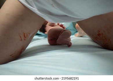 Child birth process, obstetricians supporting female, natural labour - Shutterstock ID 2195682191