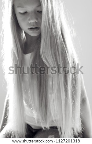 Similar – Profile portrait of a blonde and sad woman