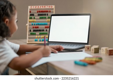 Child, blank laptop and homework for distance learning and online education during math lesson. Abacus, pc and elearning with a little girl streaming her internet class for mathematics and writing