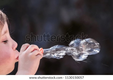 Similar – Image, Stock Photo Girl plucks off a piece of cotton candy