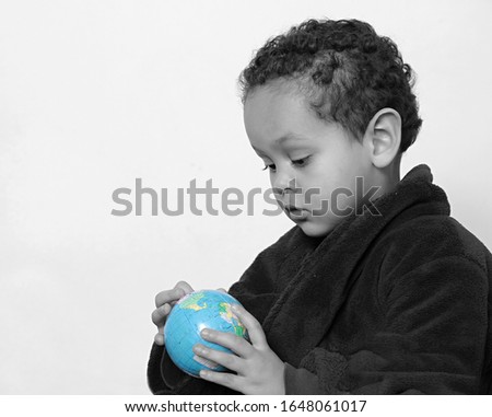child with blue globe on earthday stock photo 