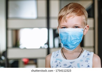 A Child In A Blue Protective Mask, In The Room