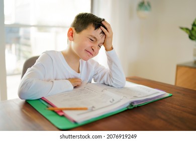 The Child Bored And Frustrated And Fed Up Doing His Homework