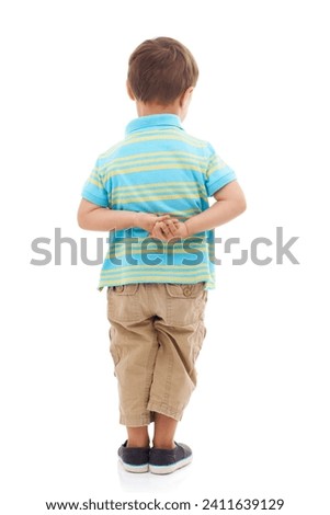 Child, boy and back in studio or white background for nervous student, kindergarten or mockup. Male person, kid and hands for anxiety or growing shy or innocent worry for mistake, problem or fear