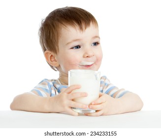 Child Boy Drinking Milk Or Yogurt From Glass