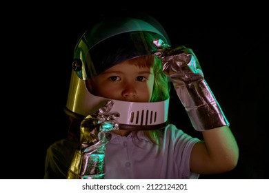 Child Boy Imagines Himself To Be An Astronaut In An Space Helmet. Close Up Kids Face On Black.