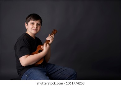 Child, Boy Learning The Ukelele