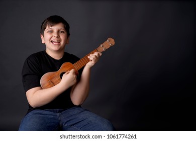 Child, Boy Learning The Ukelele