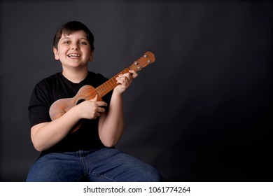 Child, Boy Learning The Ukelele