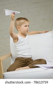 Child Boy With Paper Airplane