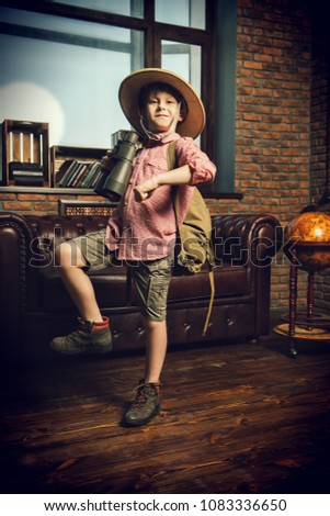 Child boy playing at home in traveler. Childhood. Fantasy, imagination. 