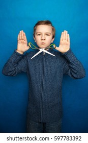 Child boy with scissors isolated