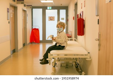 Child, Boy, Sitting In The Waiting Room In Emergency, Waiting For Examination And Xrays