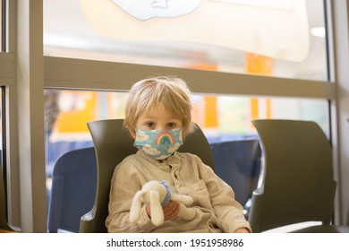 Child, Boy, Sitting In The Waiting Room In Emergency, Waiting For Examination And Xrays