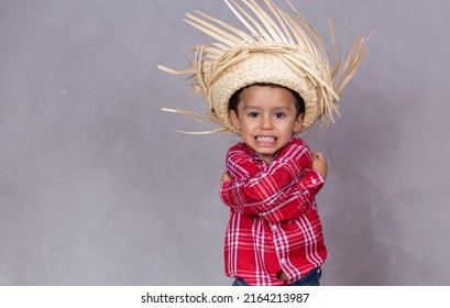 Child Boy With Typical Clothes Of The Famous Brazilian Party Called 