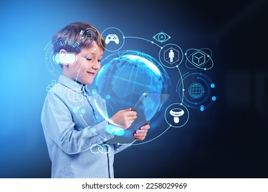 Child boy using tablet, metaverse hologram with different glowing icons, virtual reality and worldwide connection. Concept of online education and gaming