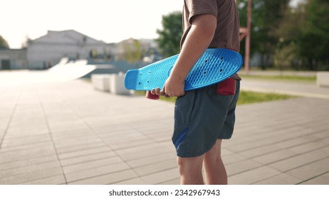 child boy walk skateboarder on the playground. boy walk skateboarder on the background. happy family child dream concept. Skateboarder boy child outdoor lifestyle - Powered by Shutterstock