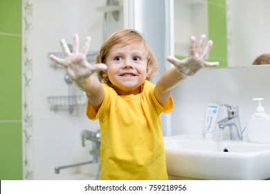 Child Boy Washing His Hands And Showing Soapy Palms.