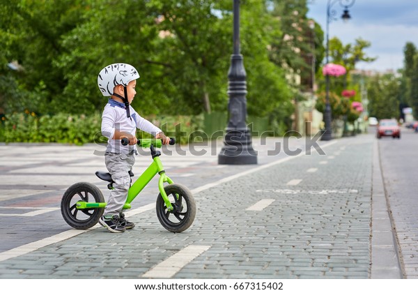 Child Boy White Helmet Riding On Stock Photo Edit Now 667315402