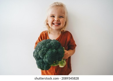 Child With Broccoli Vegetable Healthy Food Vegan Cooking Eating Sustainable Lifestyle Organic Veggies Harvest Plant Based Diet Nutrition Funny Kid Girl Happy Smiling Toddler