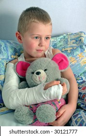 Child With Broken Hand In Plaster