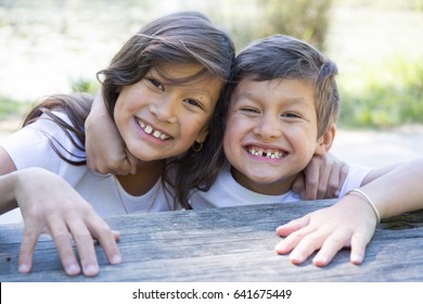 Child brother and sister laughs both - Shutterstock ID 641675449