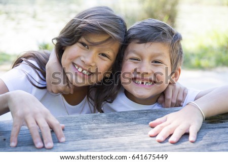 Child brother and sister laughs both