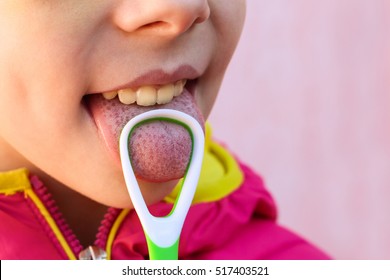 Child Brushing His Tongue 