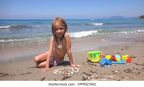 Child Building Castle on Beach at Sunset, Kid Playing Sands on Seashore, Girl Portrait on Seaside, Ocean View, Happy Children