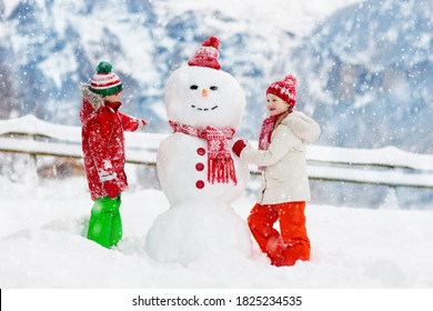 Child Building Snowman Kids Build Snow Stock Photo (Edit Now) 1825234535