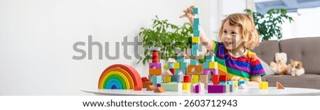 A child builds from blocks. Selective focus. kid.